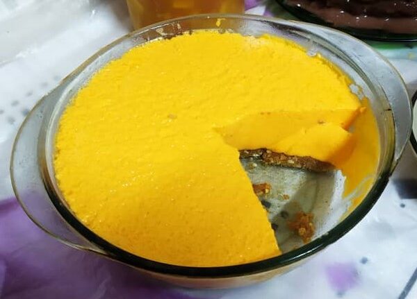 orange gelatin flan and cookie base with many