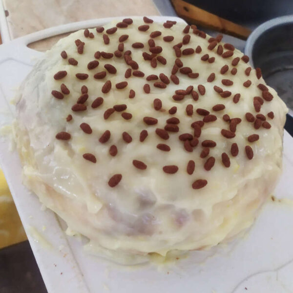 lemon cake with lemon custard and chocolate pieces on the outside