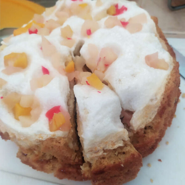 spongy lemon cake with fruits and meringue