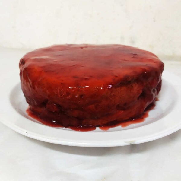 Vanilla sponge cake dipped with strawberry jelly